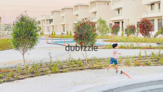 In Sheikh Zayed, a townhouse for sale in installments in Lake West Compound, in front of City Walk