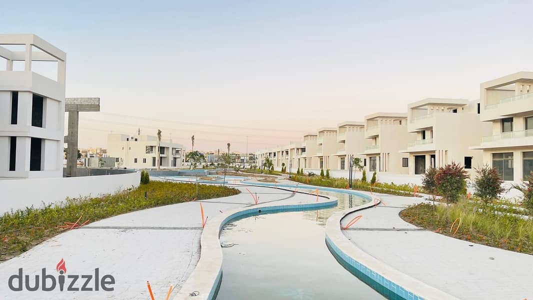 In Sheikh Zayed, a townhouse for sale in installments in Lake West Compound, in front of City Walk 5