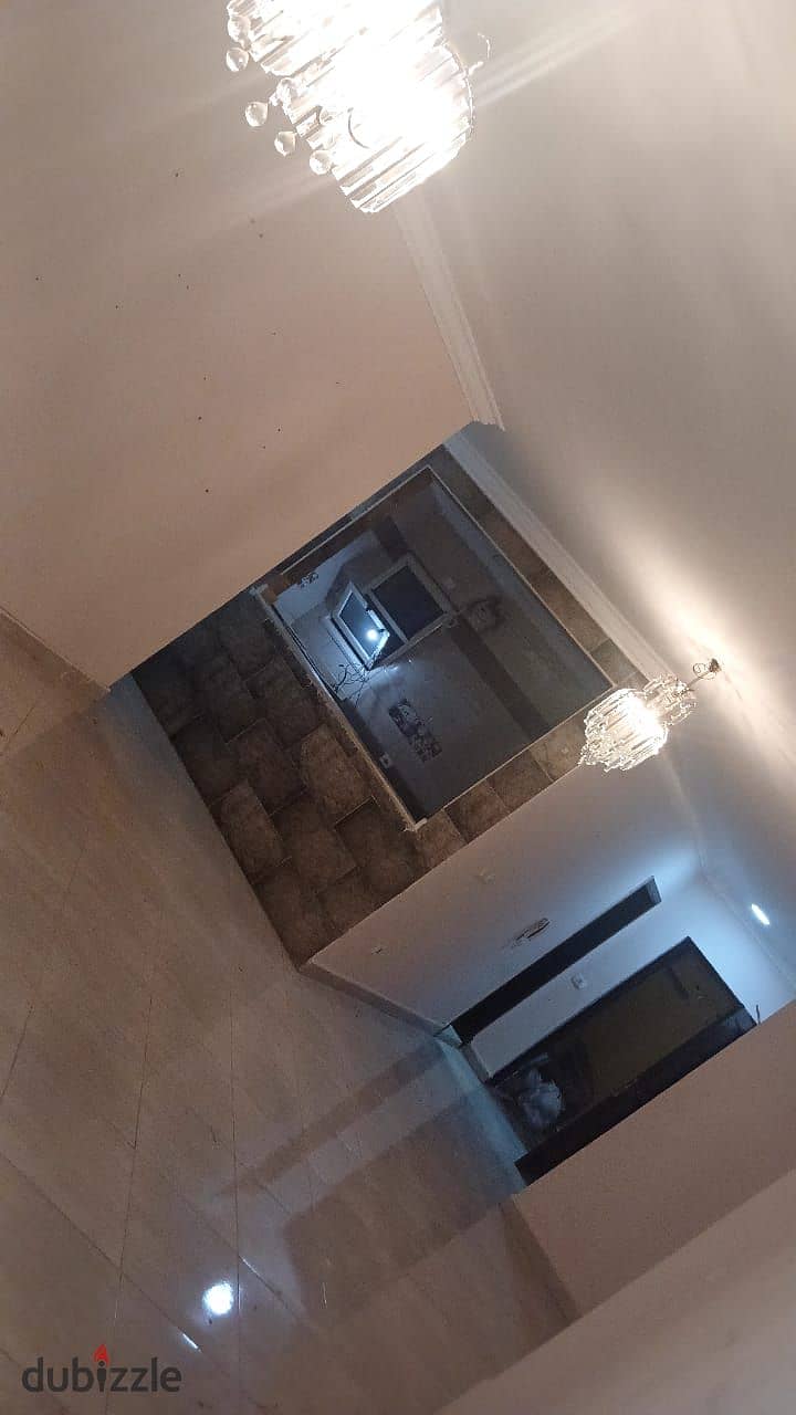 A spacious apartment for rent in Dar Misr Al-Qronfol Compound, First Settlement, in front of Gate 24 Al-Rehab 5