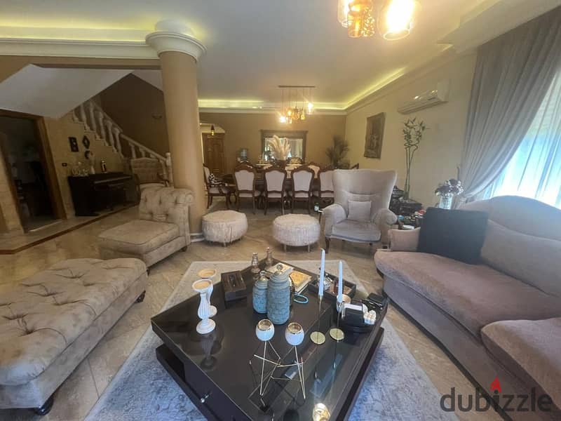 Twin villa for sale, ultra super luxury finishing, with air conditioning and appliances, in Mena Residence compound 12