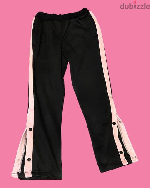 Wide trousers with side buttons - بنطلون بفتحة من الجناب 0