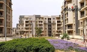 apartment for sale at new nages new cairo | installments | prime location | Ready to move | ground with garden