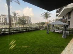 A luxury furnished apartment ground floor with garden  for rent in  Compound cairo festival city , Fifth Settlement