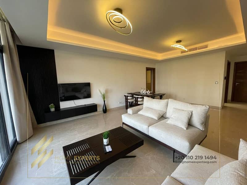 A luxury furnished apartment ground floor with garden  for rent in  Compound cairo festival city , Fifth Settlement 5