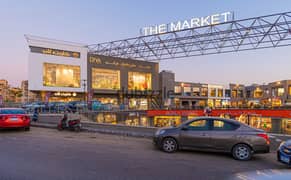 A store for sale in the Fifth Settlement, rented with a monthly return, in The Market Mall, next to the Gomla Market