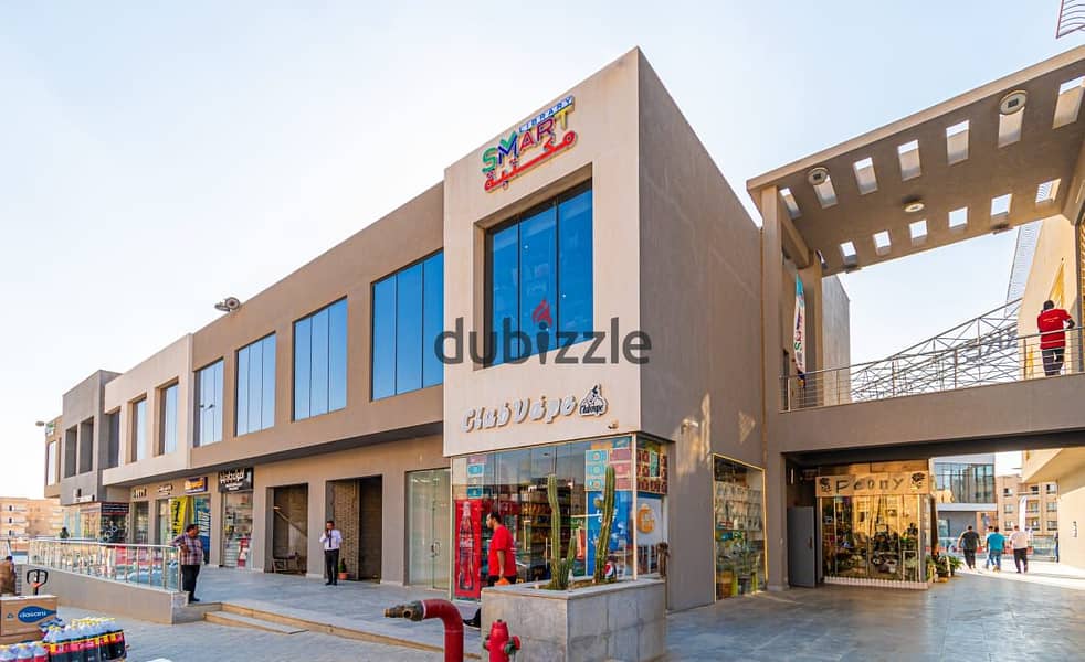 A store for sale in the Fifth Settlement, rented with a monthly return, in The Market Mall, next to the Gomla Market 5