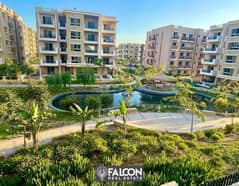 For sale after discount, an apartment with a garden in front of Cairo Airport and next to the Marriott Hotel in Taj City, New Cairo