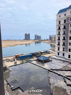 Receive immediately a 158m2 fully finished apartment with a sea view overlooking the lagoon and landscape for sale in the Latin Quarter, New Alamein