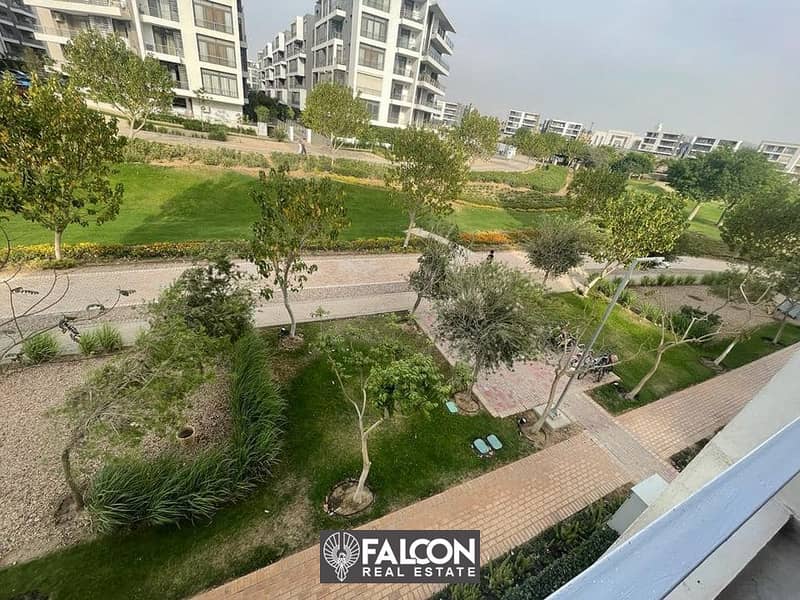 For sale, an apartment in the TAJ CITY compound, next to Cairo International Airport and directly on the Suez Road, with a 10% down payment and intere 11