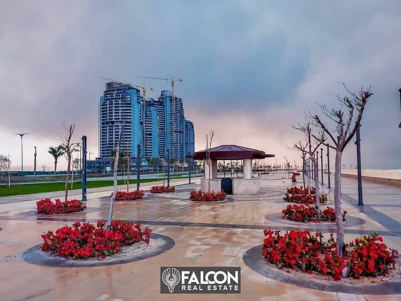 First row apartment on the Lagoon, ready for viewing, fully finished, distinguished, in installments, for sale in the Latin Quarter, New Alamein City 9