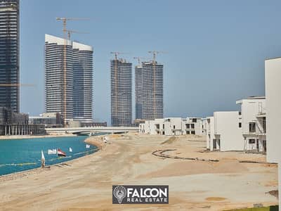 (Delivered within a year and a half) A fully finished villa with a10% down payment, first row on the sea next to El Alamein Towers in Mazarine, North