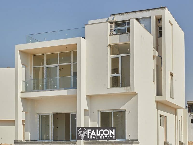 (Delivered within a year and a half) A fully finished villa with a10% down payment, first row on the sea next to El Alamein Towers in Mazarine, North 9