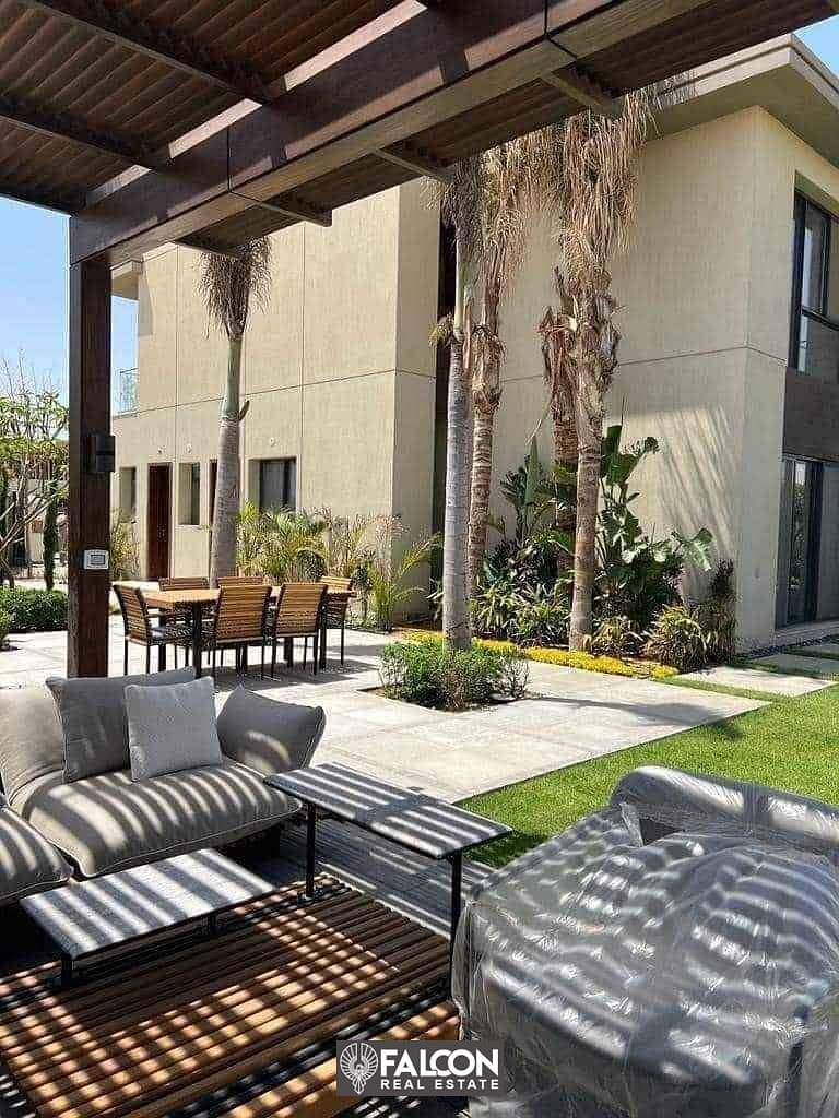 Apartment for sale in a garden (with a 42% discount on cash + installments) in New Cairo, in a distinctive location in Taj City 9