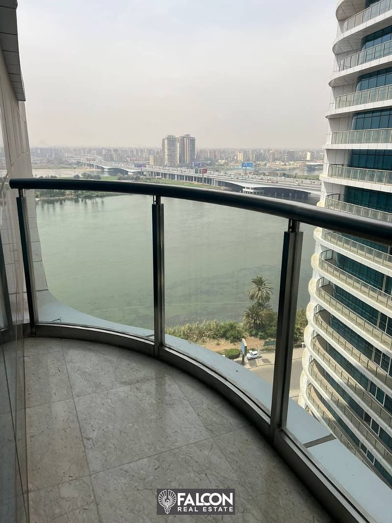 For sale, a hotel apartment overlooking the Nile directly, immediate delivery + finished (with air conditioners + furniture + appliances) in installme 2