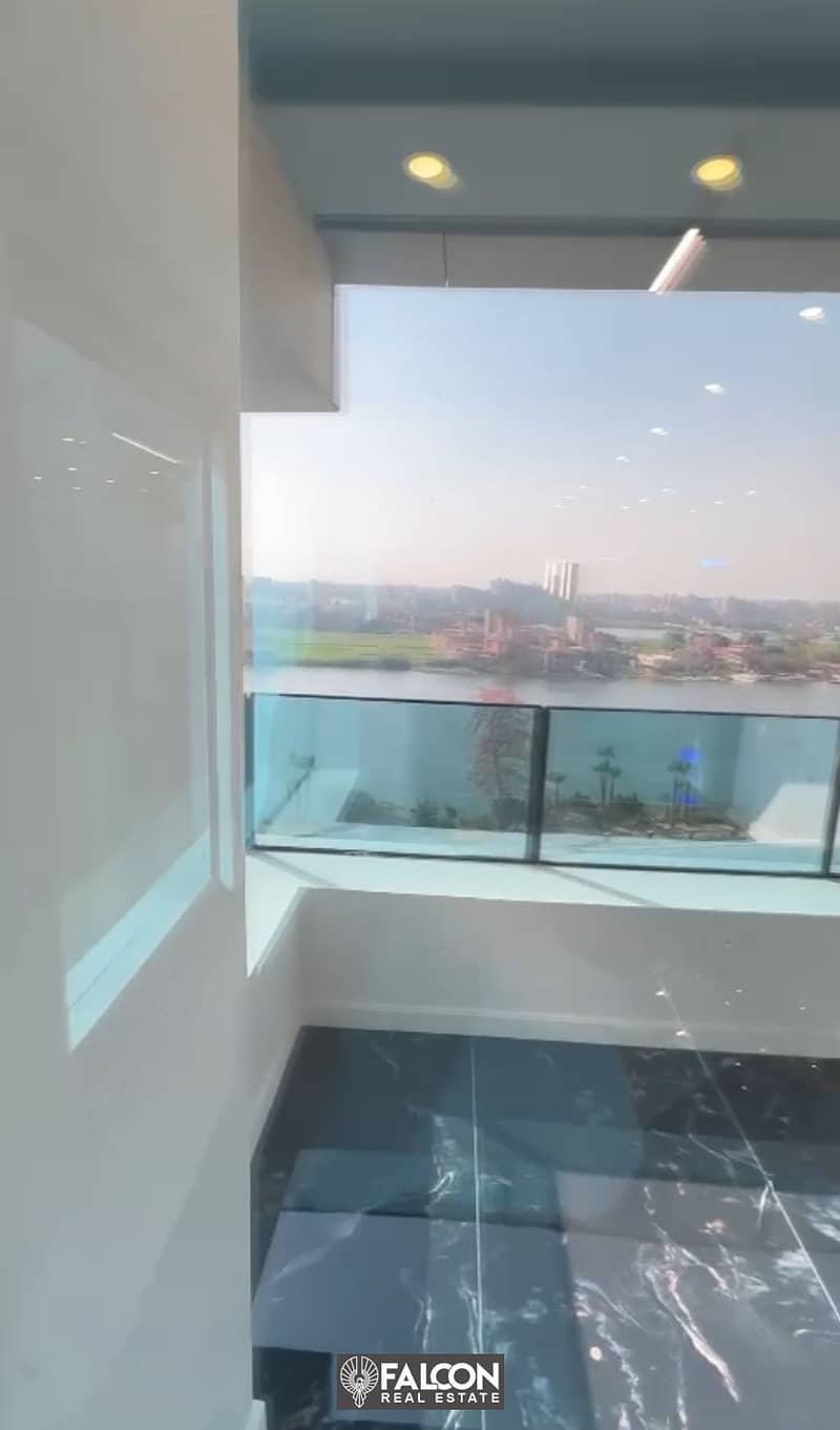 For sale, a hotel apartment overlooking the Nile directly, immediate delivery + finished (with air conditioners + furniture + appliances) in installme 8