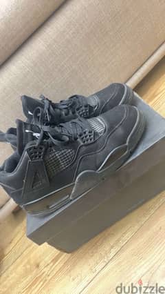 black cats jordan 4’s