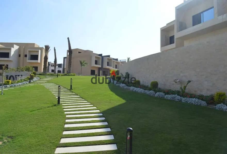 Best price for a townhouse villa, middle, immediate delivery, near Al Jazeera Club 7