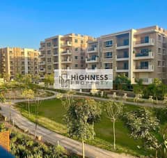 Apartment for sale at the old price ground floor in a garden, directly in front of Cairo International Airport next to the Kempinski Hotel in Taj City