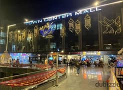 For sale, a ground floor commercial store in Town Center Mall, with the highest traffic in Shorouk City, among the most famous brands, immediate deliv