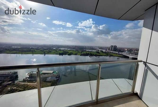 For sale, an Apartment with a full view of the Nile in the Nile Peral Towers, Ready to move  finishing, upscale hotel, service and management from 2