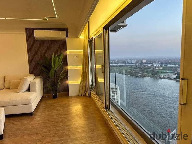 For sale, an Apartment with a full view on the Nile, Ready to move , fully finished + air conditioners and appliances from Samsung, in Maadi Towers 2