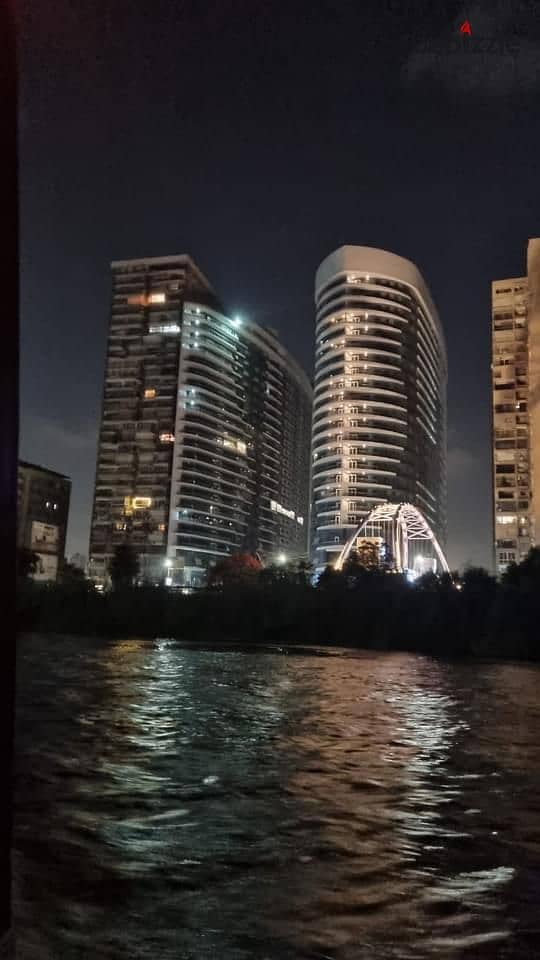 For sale, an Apartment with a full view on the Nile, Ready to move , fully finished + air conditioners and appliances from Samsung, in Maadi Towers 3