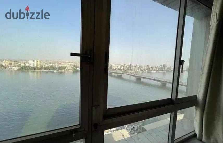 For sale, an Apartment with a full view on the Nile, Ready to move , fully finished + air conditioners and appliances from Samsung, in Maadi Towers 4