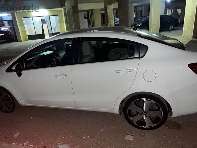 kia rio sedan 2013  كيا ريو سيدان فابريكه بره وجوه 3