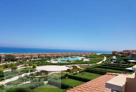 Finished sea view ground chalet with garden 125m for sale in Telal AlAlamain North Coast with installments