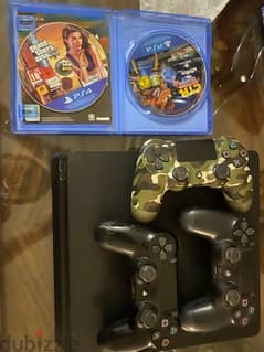 PS4 slim 1TB used like new with 3 controllers , GTA5 ,Crash,cd