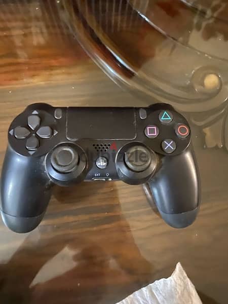 PS4 slim 1TB used like new with 3 controllers , GTA5 ,Crash,cd 3