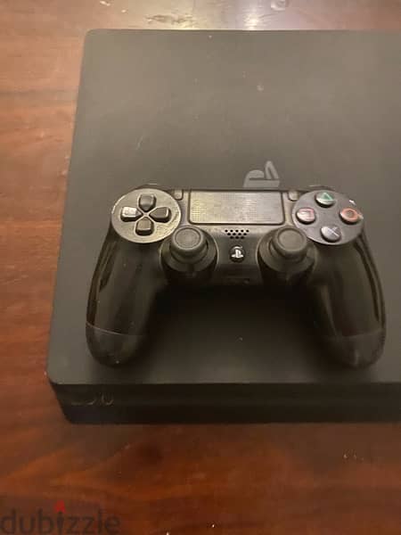 PS4 slim 1TB used like new with 3 controllers , GTA5 ,Crash,cd 6