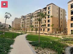 Own an apartment with a garden for sale in Sarai Compound in New Cairo, near the Fifth Settlement and the American University And Cairo airport