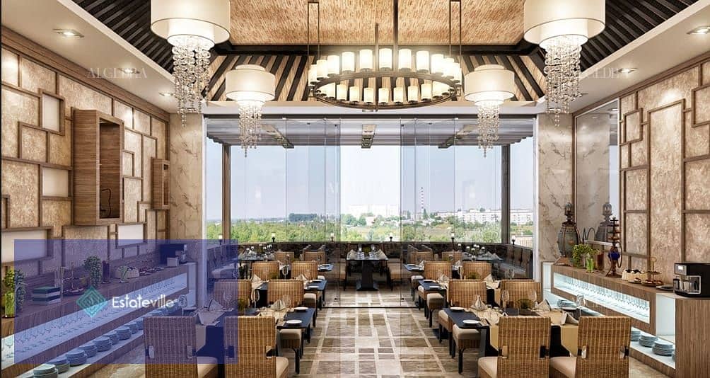 Sky Roof Restaurant and Café with a panoramic view of Al-Massa Hotel and the iconic tower in the shopping and recreation district and in front of the 5