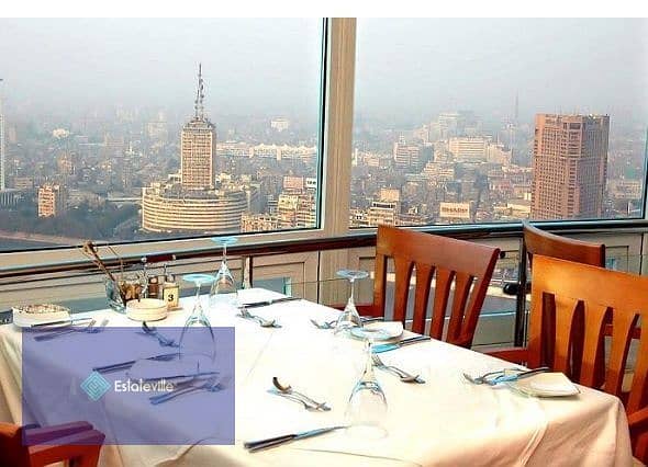 Sky Roof Restaurant and Café with a panoramic view of Al-Massa Hotel and the iconic tower in the shopping and recreation district and in front of the 6