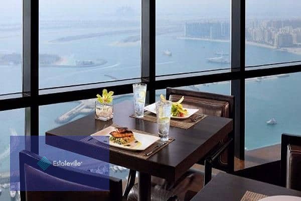 Sky Roof Restaurant and Café with a panoramic view of Al-Massa Hotel and the iconic tower in the shopping and recreation district and in front of the 7