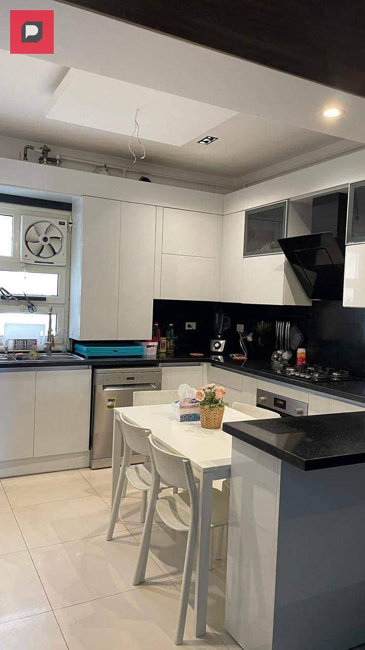 Apartment for immediate delivery, 12-year installments, 155 square meters, fully finished with air conditioners and kitchen, Arabesque Al-Fustato 2