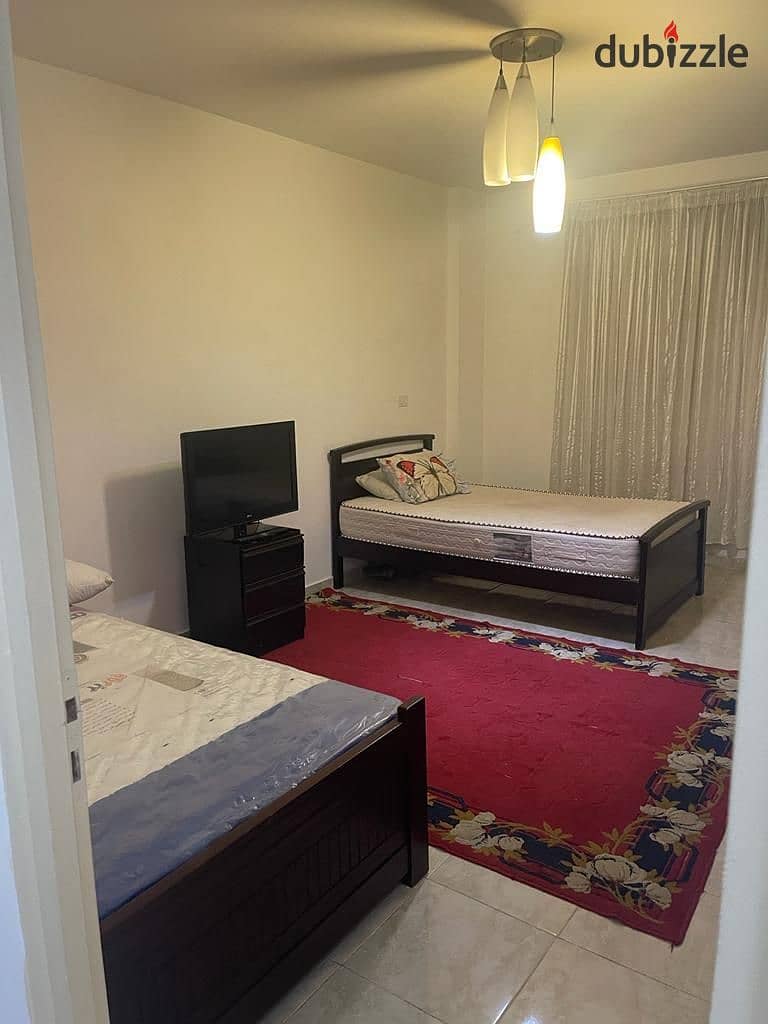 A furnished apartment is available for rent, ground floor, in Al-Rehab City 2 7