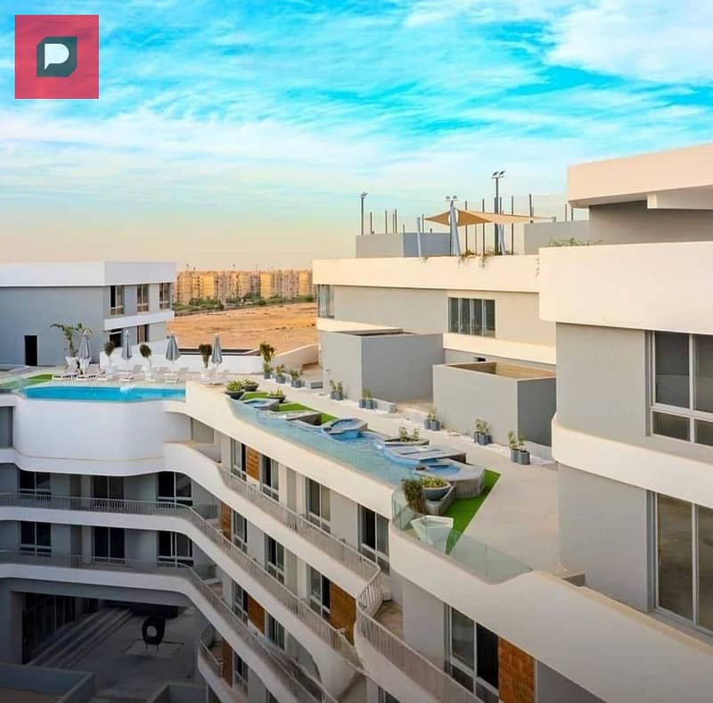 Two-bedroom apartment with a distinctive double view for sale in Bloomfields Compound in Mostakbal City near the 5th Settlement,AUC and Cairo airport 11