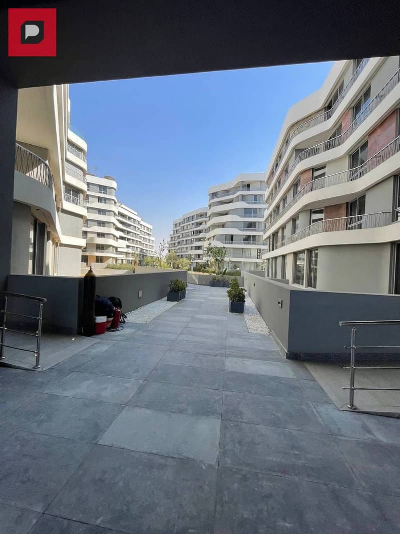 Two-bedroom apartment with a distinctive double view for sale in Bloomfields Compound in Mostakbal City near the 5th Settlement,AUC and Cairo airport 4