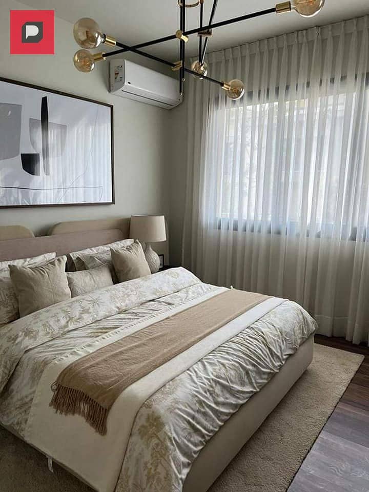 Two-bedroom apartment with a distinctive double view for sale in Bloomfields Compound in Mostakbal City near the 5th Settlement,AUC and Cairo airport 9