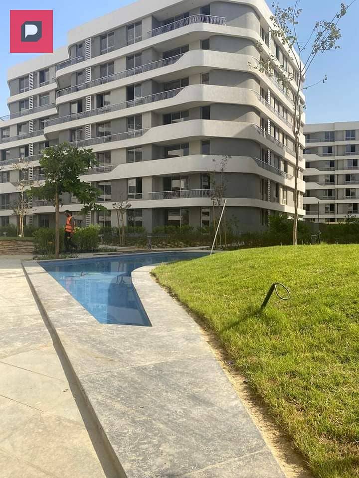 Two-bedroom apartment with a distinctive double view for sale in Bloomfields Compound in Mostakbal City near the 5th Settlement,AUC and Cairo airport 17