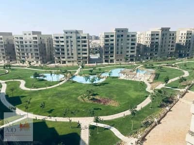 Duplex for sale in El Tagamoa, 208 m, very distinctive division, with a view, Origami Golf phase, in Taj City Compound, on Suez Road, with a 5% down p