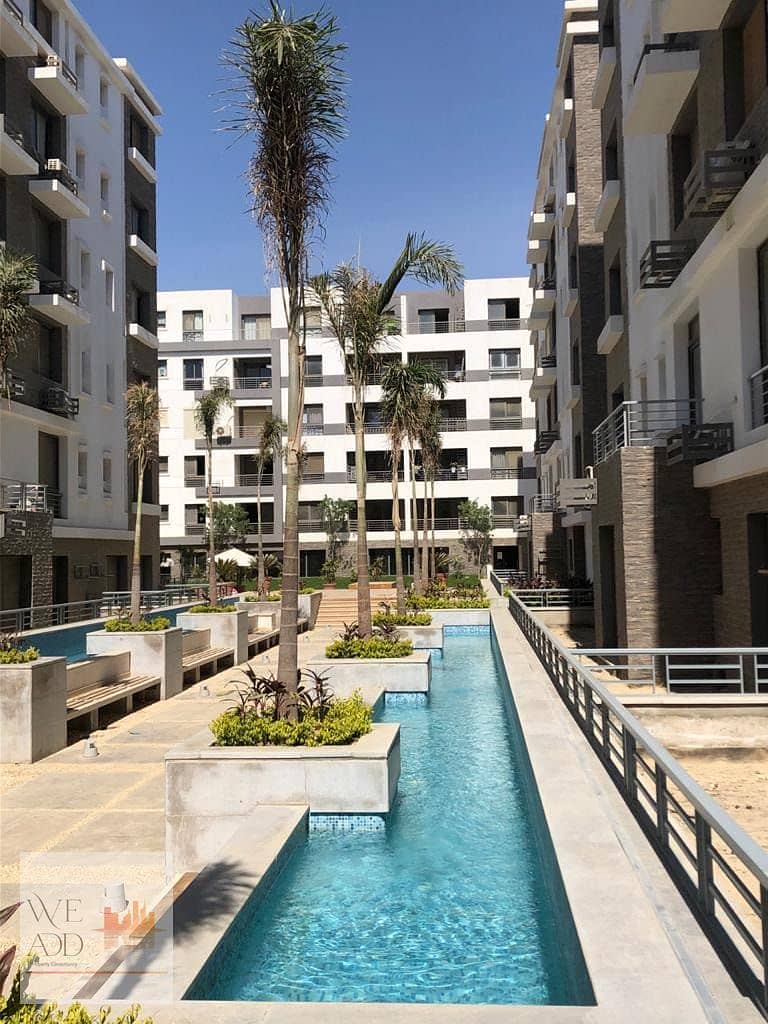 Apartment for sale in Taj City Compound, Origami Golf Phase, 132 m, very distinctive division, with the best view, with a 5% down payment and installm 0