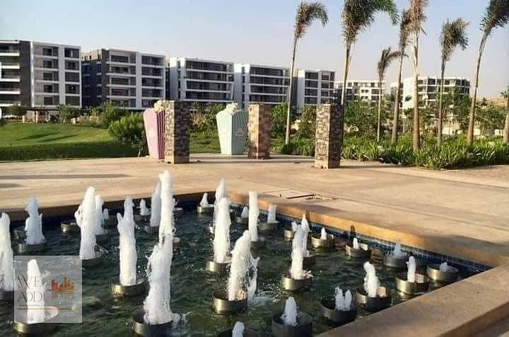 In front of Cairo Airport, a penthouse for sale, large area 224 m + roof 77 m, with a lake view and garden in Taj City Compound, with a 42% cash disco 8