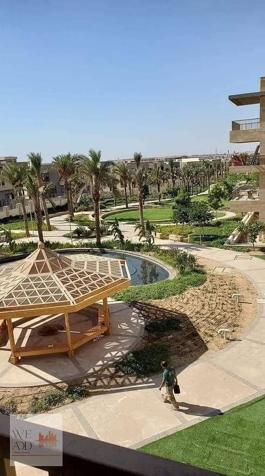 In front of Cairo Airport, a penthouse for sale, large area 224 m + roof 77 m, with a lake view and garden in Taj City Compound, with a 42% cash disco 10