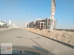 Studio with lake view, area 69 m, with a 46 m garden, for sale in Sarai Compound, Madinaty, wall by wall, with a 5% down payment and installments over