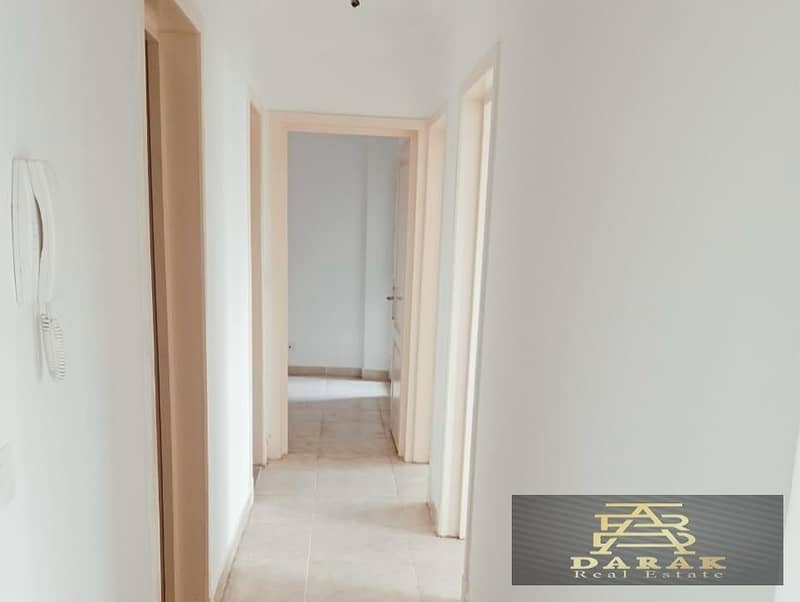 115 sqm Corner Apartment for Sale in Madinaty, B14  The apartment offers a view of a wide garden. 6