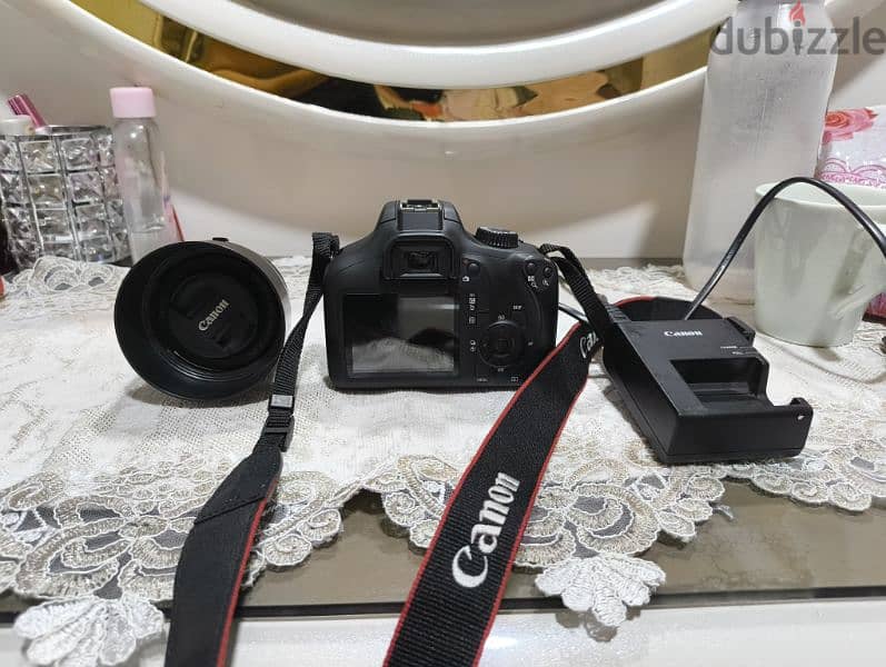 كاميرا canon 4000d بحاله الزيرو بالاضافه لعدسه ٥٠ ملي 3