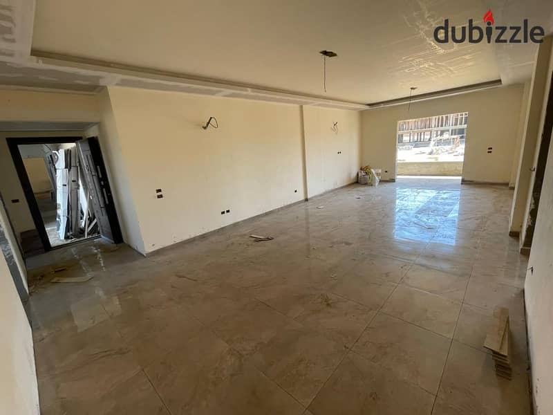 Apartment in Garden City, in the heart of Old Sheikh Zayed, fully finished, with installments over 8 years, next to Al Yasmine 2